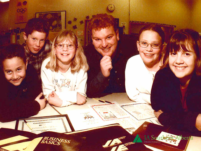 Junior-achievement-Our-business-world-volunteer-with-students-1990s